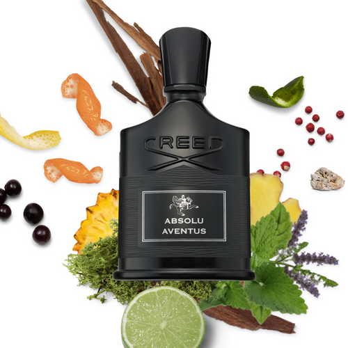 Creed Absolu Aventus EDP 75 ml bottle surrounded by bergamot, pink pepper, and cardamom, representing the fragrance’s citrus-spicy depth and luxurious masculine character.
