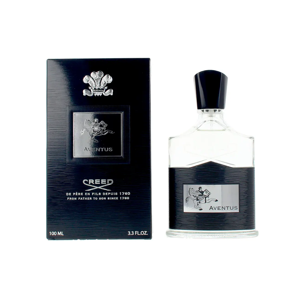 Premium display of Creed Aventus Eau de Parfum 100 ml beside its sleek black packaging. A refined masculine fragrance featuring pineapple, birch, and oak moss notes — crafted by Oliver and Erwin Creed for men who exude strength and elegance.