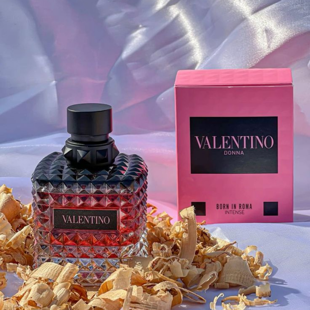 Fragrance Emporium – Valentino Donna Born in Roma Intense Eau de Parfum bottle with packaging box, photographed against a modern feminine background. A sensual women’s fragrance with floral and vanilla notes.