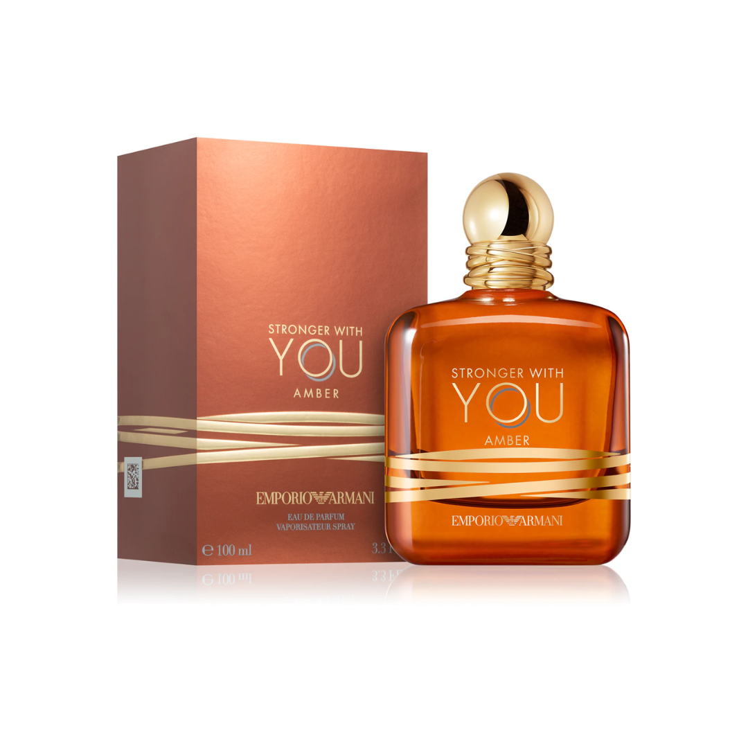 Authentic Emporio Armani Stronger With You Amber EDP 100 ml bottle beside its elegant packaging, photographed for Fragrance Emporium. Highlights the luxurious presentation and warm amber fougère blend of spicy amber, lavender, and vanilla for refined men.