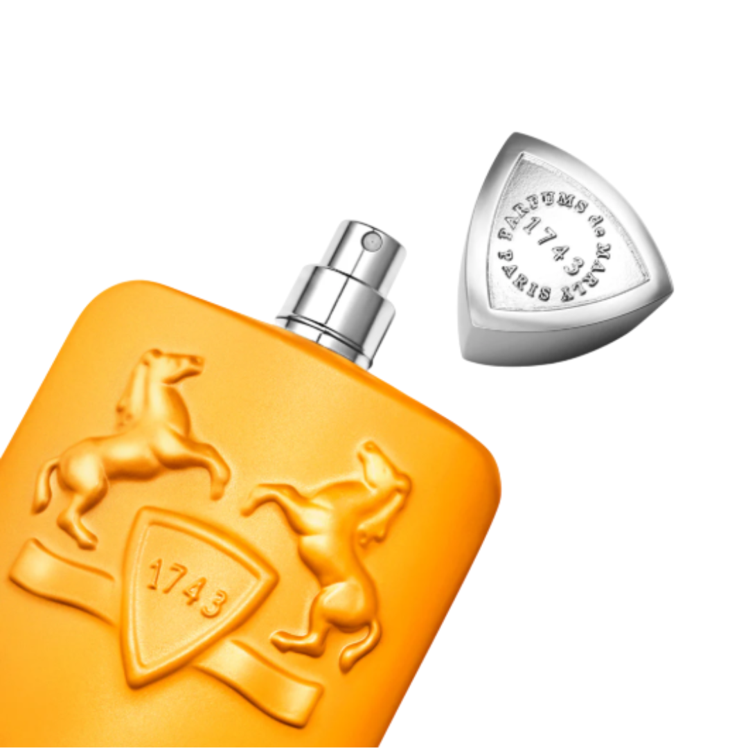 Fragrance Emporium – Parfums de Marly Perseus Eau de Parfum, orange bottle shown at an angle with silver cap off. Premium unisex citrus fragrance presentation.