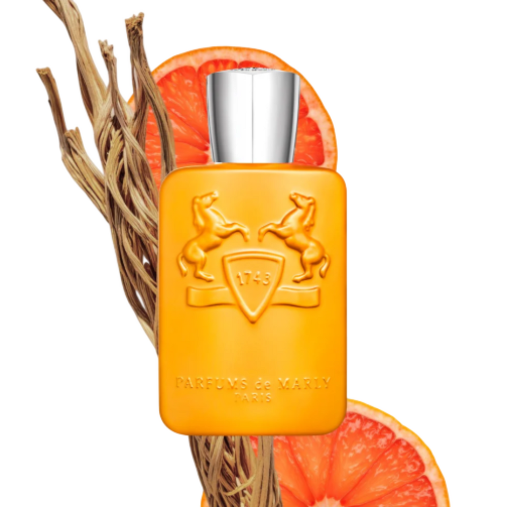 Fragrance Emporium – Parfums de Marly Perseus Eau de Parfum photographed with orange slices and vetiver roots, highlighting its citrus and woody fragrance notes.
