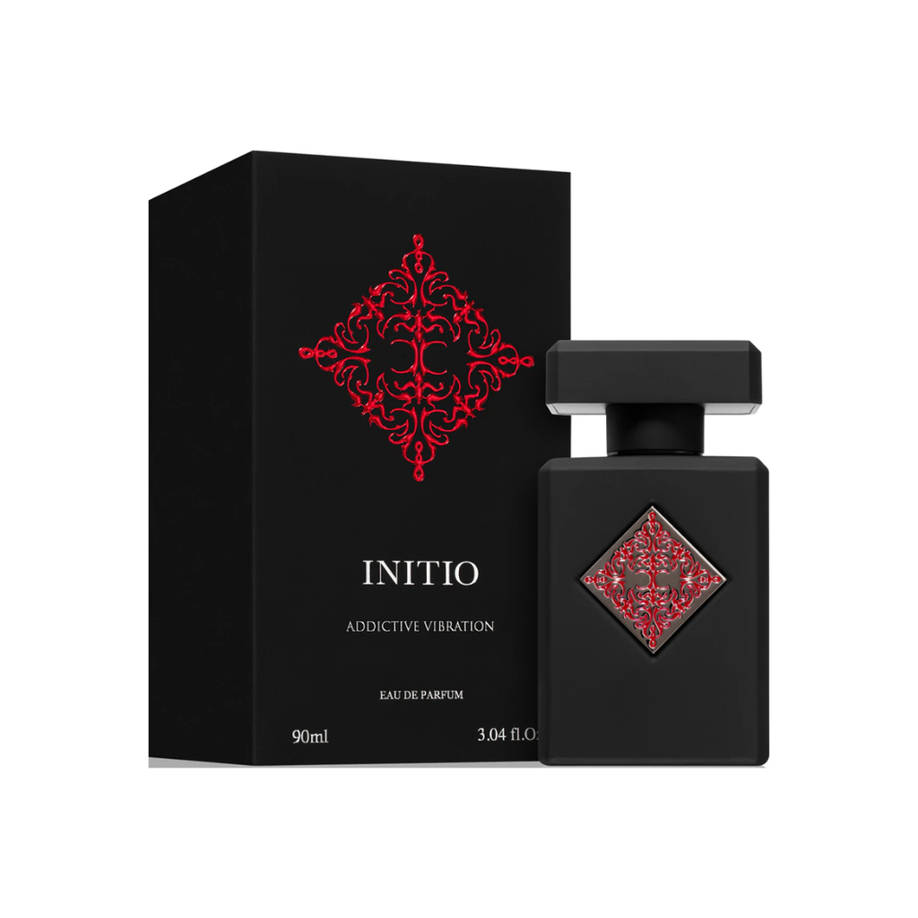 Initio Absolute Aphrodisiac EDP 90 ml bottle and box in luxurious black and red tones. A sensual unisex amber vanilla fragrance blending musk, leather, and amber. Sold by Fragrance Emporium.

