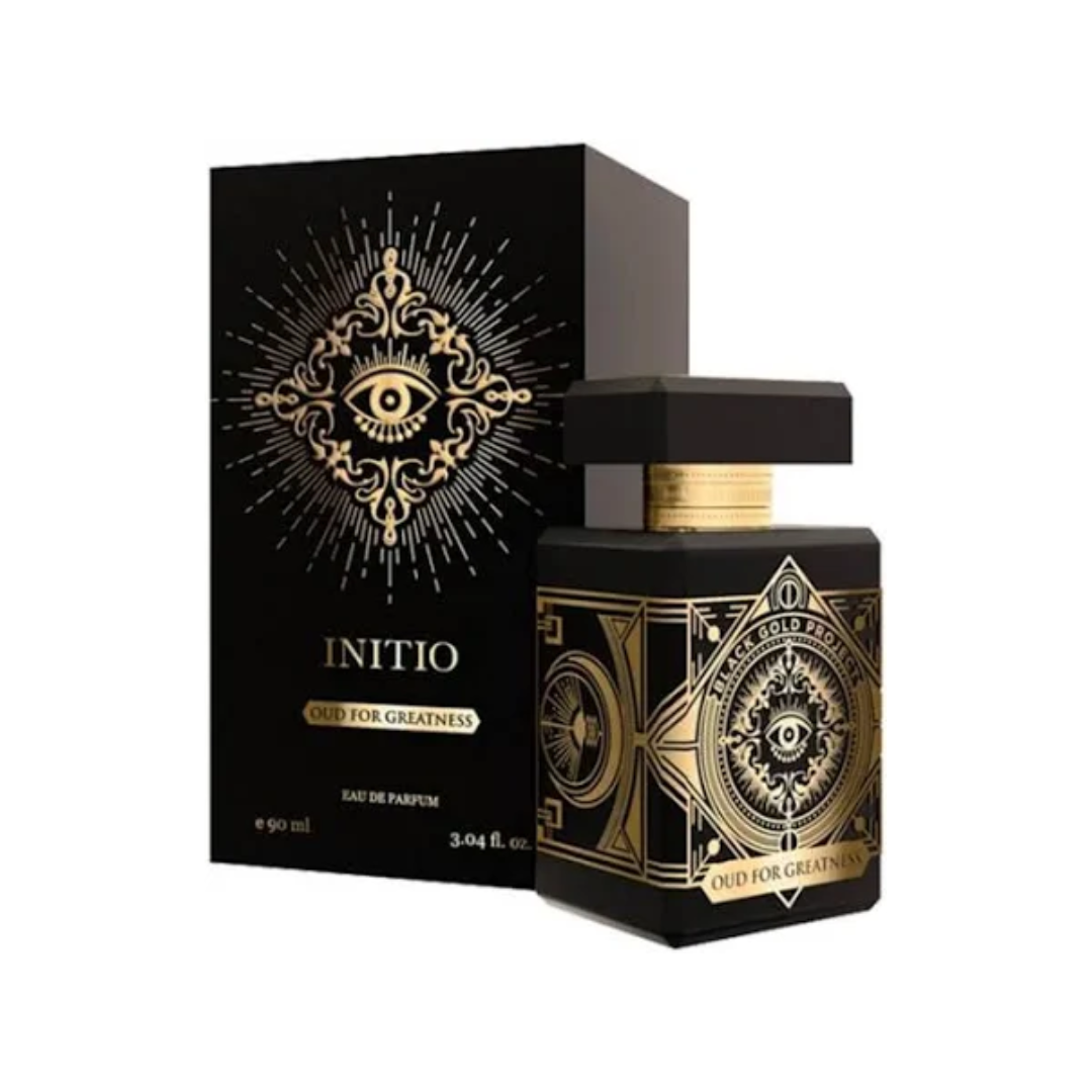 Initio Oud For Greatness EDP 90 ml bottle and box in black and gold tones. A powerful unisex amber oud fragrance with saffron, nutmeg, and patchouli. Sold by Fragrance Emporium.
