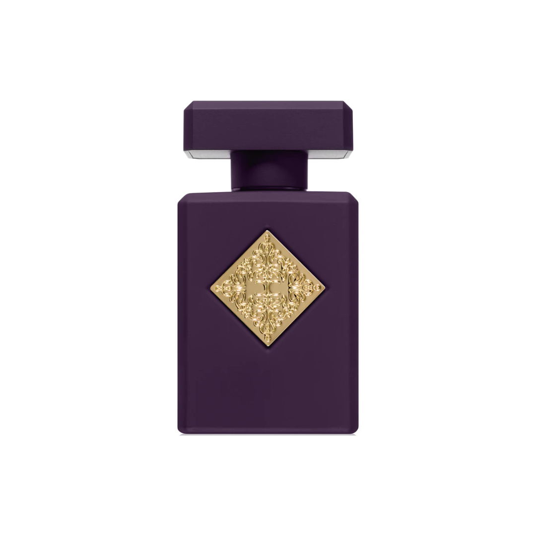 Initio Side Effect EDP 90 ml perfume bottle in deep purple with a golden label. A luxurious unisex amber fragrance blending rum, tobacco, cinnamon, and vanilla. Available at Fragrance Emporium.
