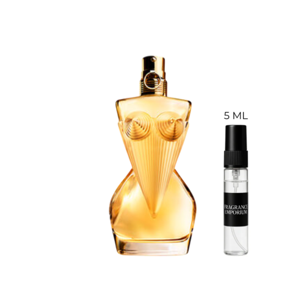Jean Paul Gaultier Divine Eau de Parfum bottle next to a 5 ml sample vial under soft studio lighting. A radiant blend of lily, ylang-ylang and musk that embodies modern femininity — offered in 5 ml premium samples by Fragrance Emporium.