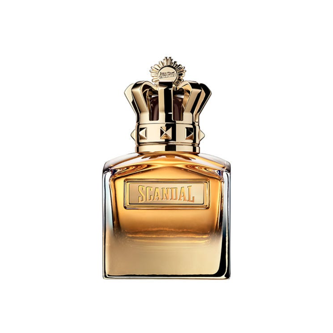 Close-up of Jean Paul Gaultier Scandal Pour Homme Absolu Eau de Parfum 100 ml, featuring its luxurious golden bottle topped with a crown-shaped cap. The image highlights the fragrance’s regal design and rich woody amber composition with notes of mirabelle, chestnut, and sandalwood — symbolizing power, sensuality, and masculine sophistication.