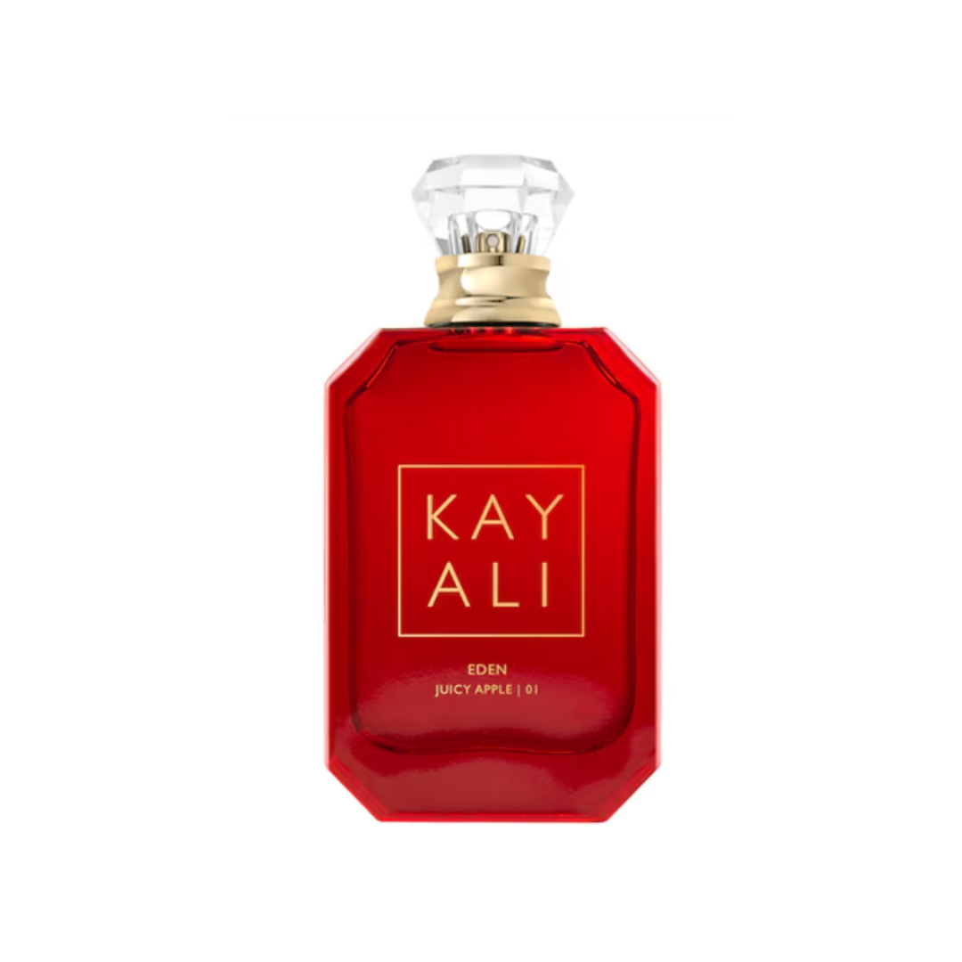 High-resolution image of Kayali Eden Juicy Apple 01 EDP 100 ml perfume bottle in glossy red glass with a crystal cap. A vibrant fruity-floral gourmand scent blending red apple, lychee, jasmine, and vanilla flower for a sweet, playful touch. Available at Fragrance Emporium.