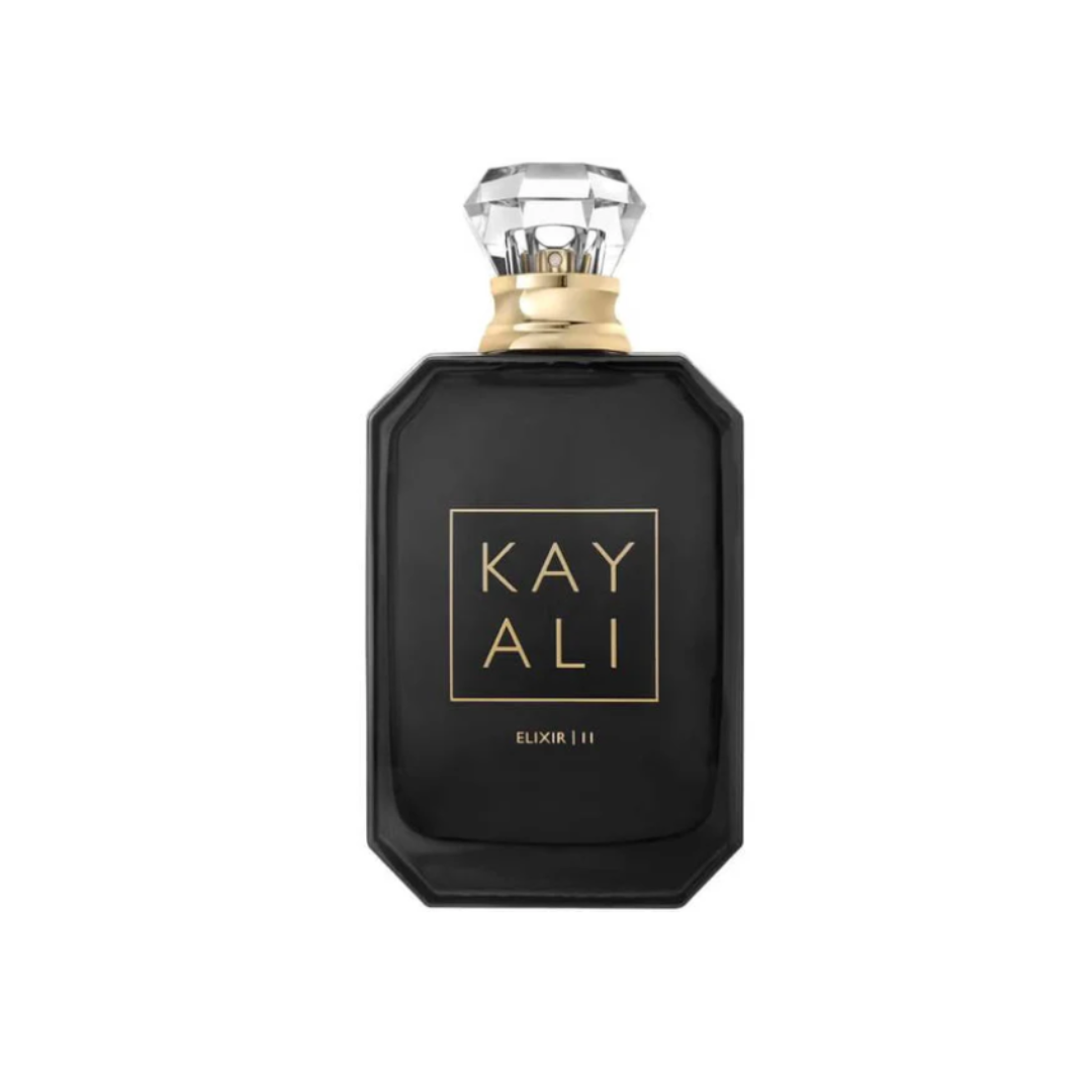 High-quality image of Kayali Elixir 11 EDP 100 ml perfume bottle in sleek black glass with a gold label and crystal cap. A luxurious floral-amber scent blending red apple, rose de mai, jasmine sambac, and vanilla. Intense, feminine elegance — available at Fragrance Emporium.