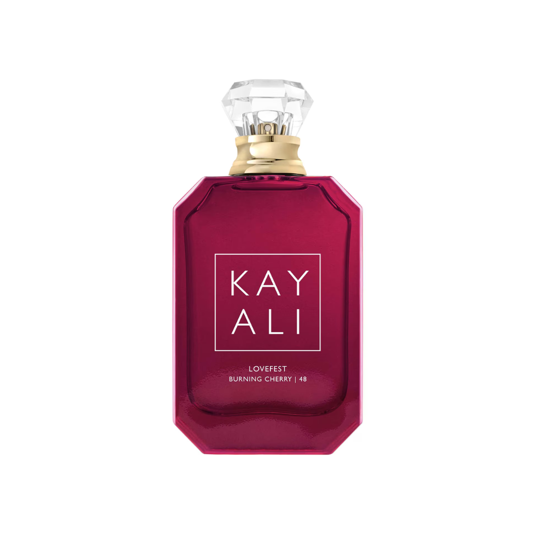 High-quality image of Kayali Lovefest Burning Cherry 48 EDP 100 ml perfume bottle in deep cherry-red glass with gold cap. A warm amber vanilla fragrance for women, blending burning cherry, praline, and tonka bean with guaiac wood and rose. Available at Fragrance Emporium.