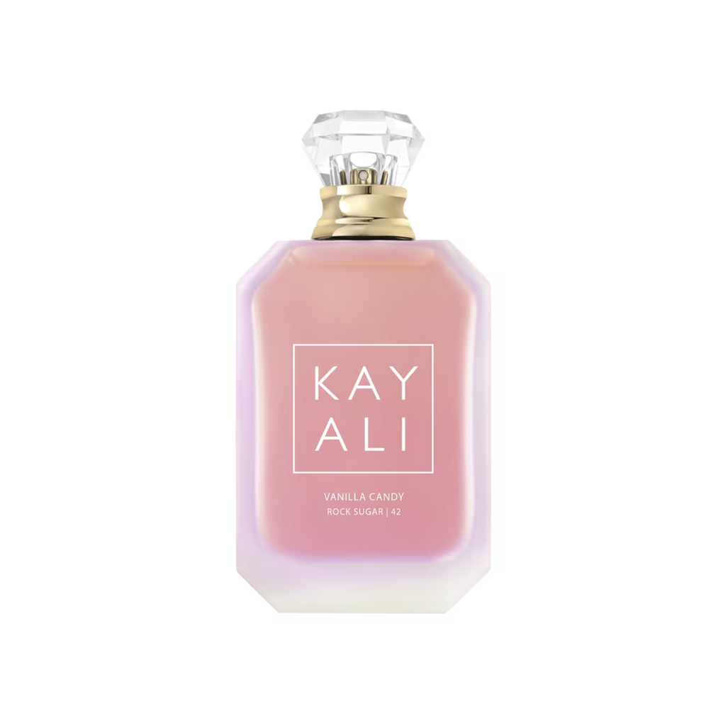 High-resolution image of Kayali Vanilla Candy Rock Sugar 42 EDP 100 ml perfume bottle in pastel pink glass with a crystal cap. A playful vanilla gourmand fragrance featuring glazed pear, bubble gum, and creamy caramel with tonka bean and sandalwood. Available at Fragrance Emporium.