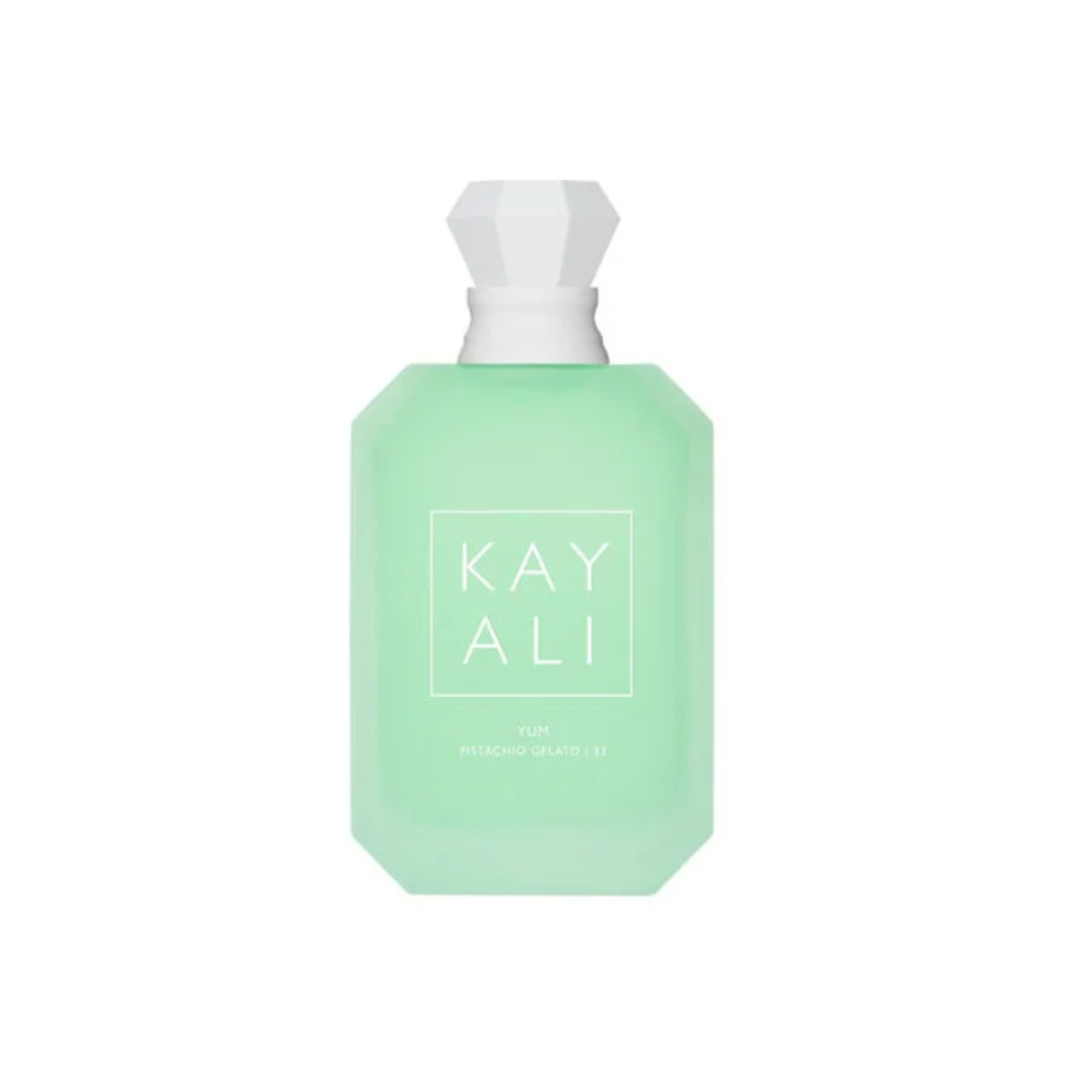 High-quality image of Kayali Yum Pistachio Gelato 33 EDP 100 ml perfume bottle in soft mint green glass with a crystal cap. A delectable gourmand fragrance blending pistachio, whipped cream, hazelnut, and marshmallow. Sweet, creamy indulgence — available at Fragrance Emporium.