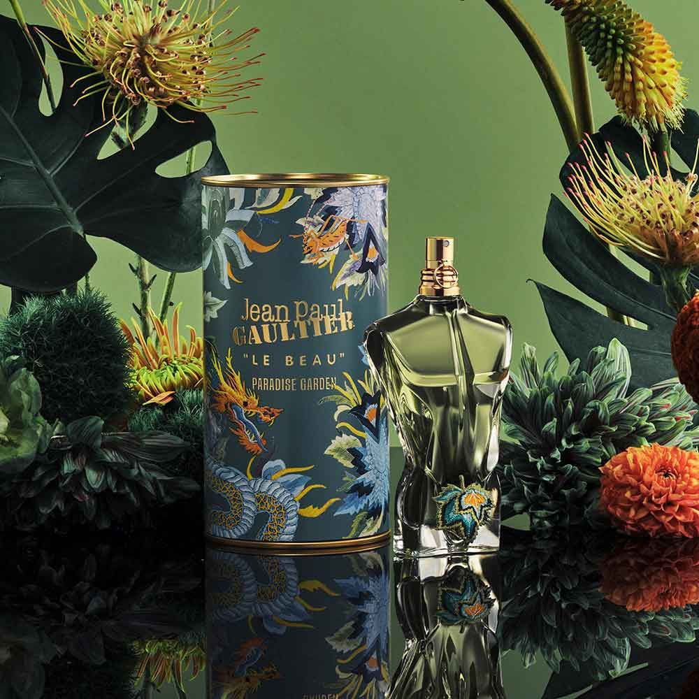 Jean Paul Gaultier Le Beau Paradise Garden Eau de Parfum bottle with its colorful tropical box, vibrant design inspired by exotic paradise gardens.