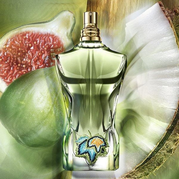 Le Beau Paradise Garden Eau de Parfum by Jean Paul Gaultier photographed in a natural setting with flowers and greenery, highlighting its fresh aquatic notes.