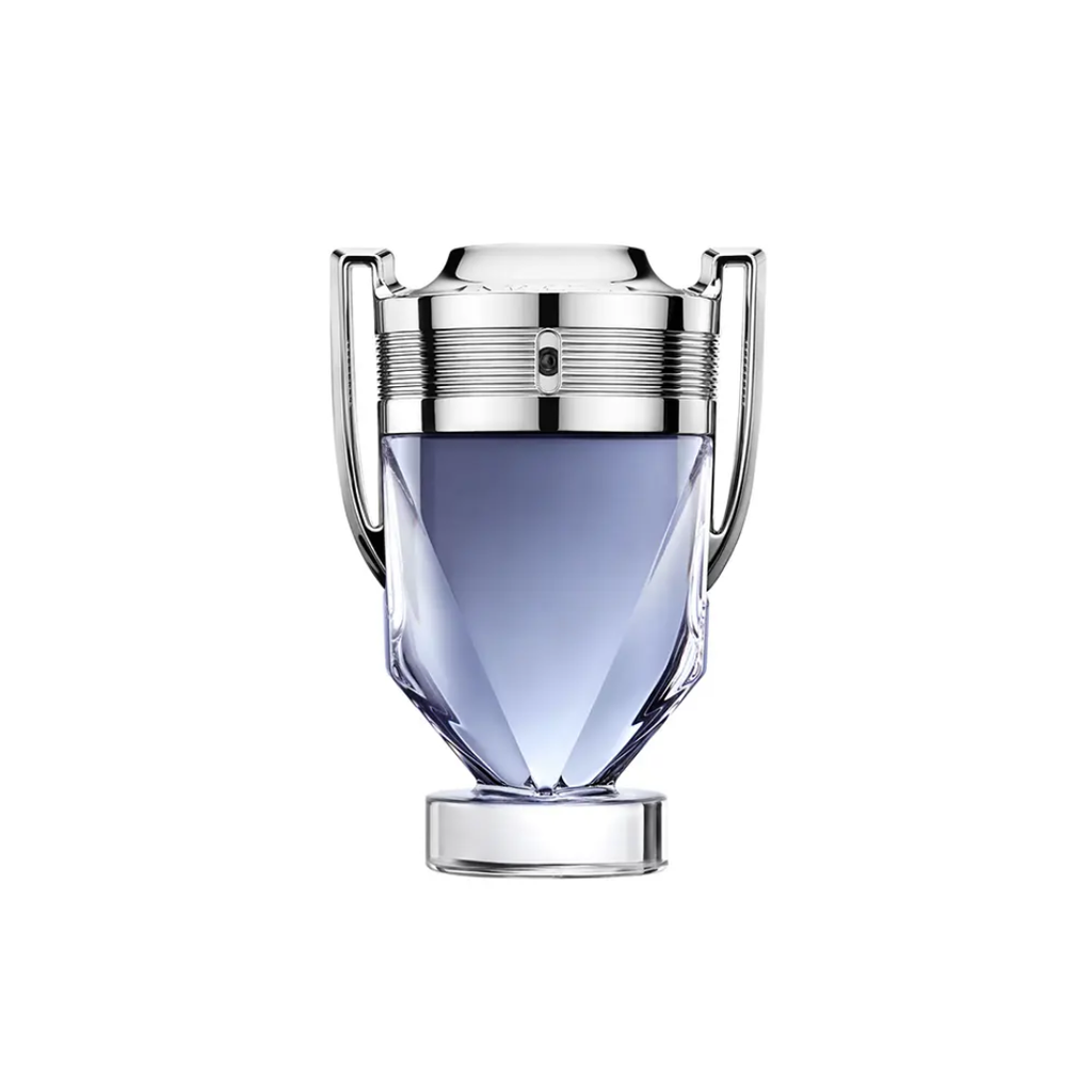 Close-up of Paco Rabanne Invictus Eau de Toilette 100 ml bottle featuring its iconic silver trophy design with light blue fragrance inside. The image represents freshness, victory, and masculine energy, perfectly reflecting the scent’s notes of grapefruit, sea breeze, jasmine, and ambergris.