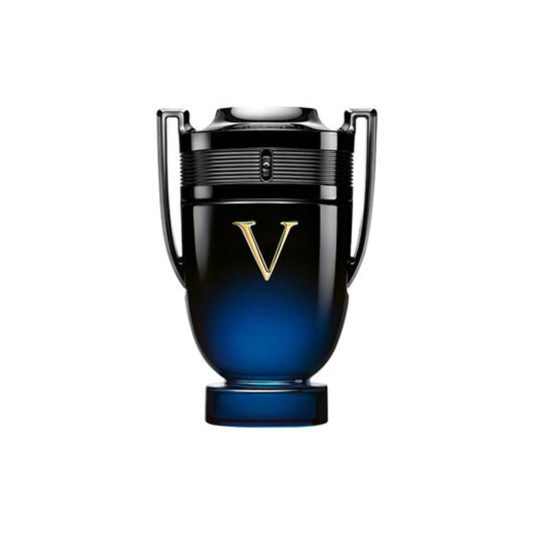 Luxury close-up of Paco Rabanne Invictus Victory Elixir EDP 100 ml perfume bottle, featuring the deep blue gradient glass trophy design. Captures the masculine amber-woody scent with notes of lavandin, green cardamom, vanilla bean, and tonka bean. Available at Fragrance Emporium.