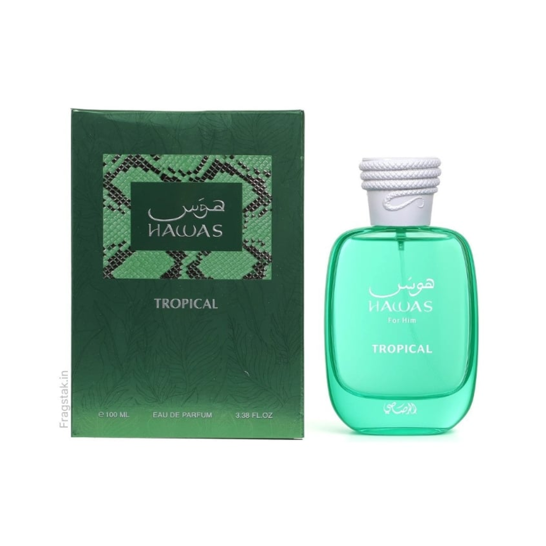 Rasasi Hawas Tropical EDP 100 ml perfume bottle displayed beside its elegant green packaging. A refreshing tropical fragrance with coconut, fig, mint, and musk notes that evoke exotic beaches and summer freedom. Shop at Fragrance Emporium.