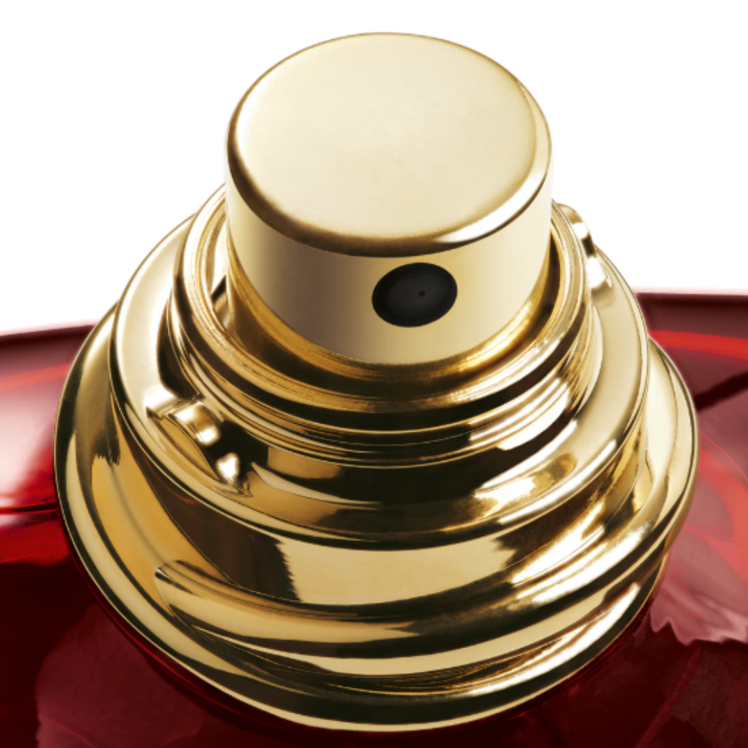 Detailed macro shot of the luxurious gold cap of Emporio Armani Stronger With You Tobacco Eau de Parfum. The close-up emphasizes the fragrance’s sophisticated design and the golden tones that mirror its warm blend of tobacco, spices, and bourbon vanilla accords.