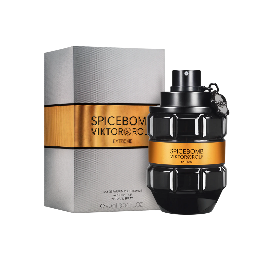 Viktor & Rolf Spicebomb Extreme EDP 90 ml perfume bottle displayed beside its silver and orange packaging. A powerful amber-spicy men’s fragrance blending black pepper, cumin, vanilla, and bourbon. Warm, explosive, and seductive — available at Fragrance Emporium.