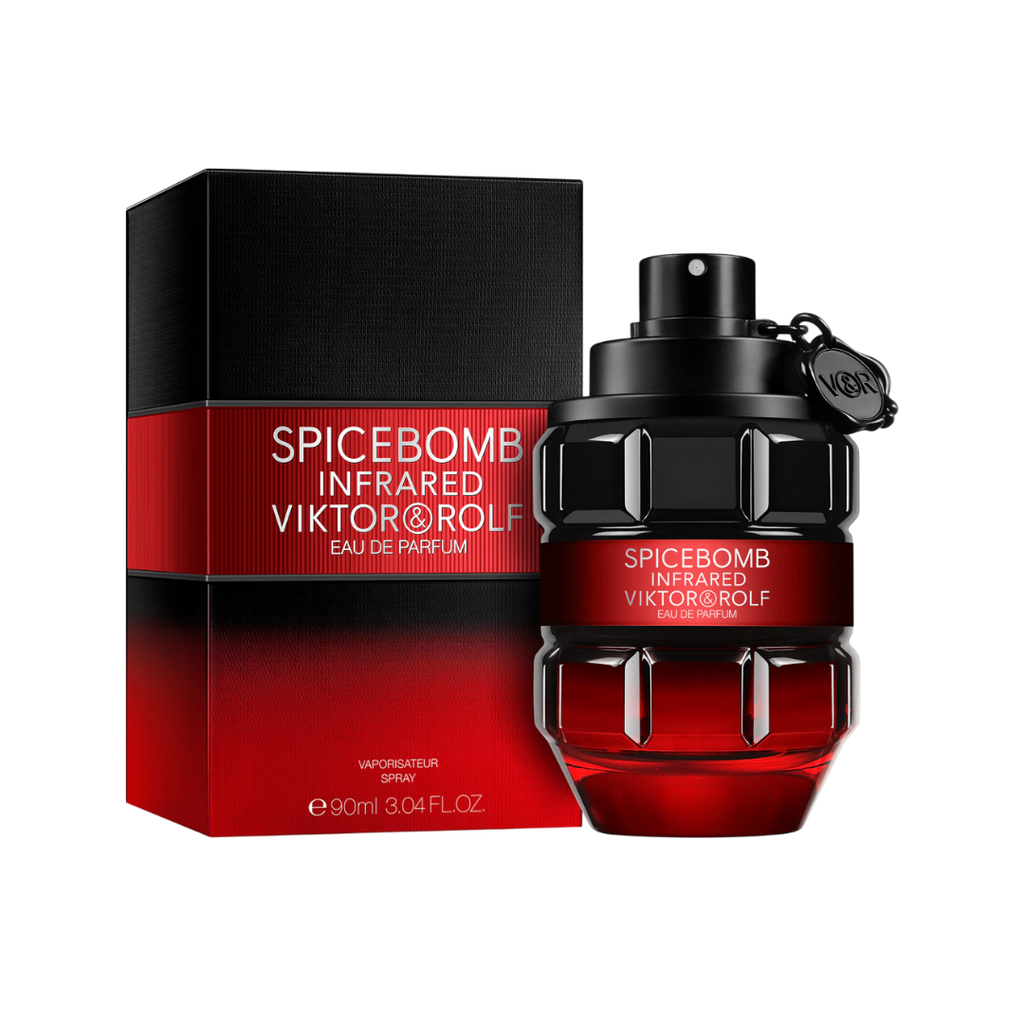 Viktor & Rolf Spicebomb Infrared EDP 90 ml perfume bottle beside its striking black and red packaging. A warm amber-spicy scent with red pepper, cinnamon, benzoin, and vanilla — bold, addictive, and masculine. Available now at Fragrance Emporium.