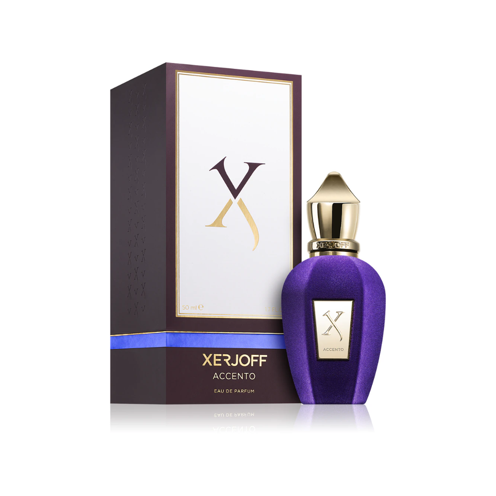Premium display of Xerjoff Accento Eau de Parfum 100 ml beside its matching elegant box. The photo captures the fragrance’s vibrant blend of pineapple, hyacinth, jasmine, and musk — a sophisticated scent that embodies modern luxury and artistic craftsmanship.