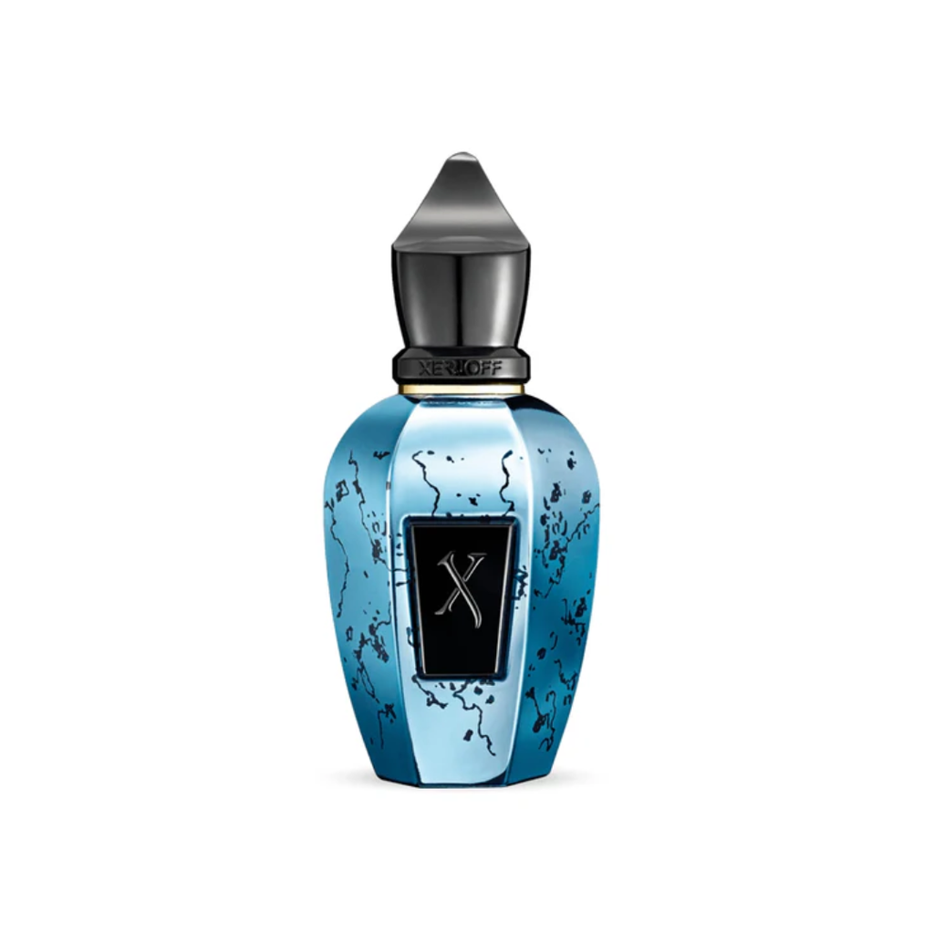 Close-up of Xerjoff Groove Xcape Eau de Parfum 50 ml in its striking turquoise-blue bottle with black cap and refined design. The image highlights the fragrance’s modern elegance and its woody amber composition blending grapefruit, pink pepper, cardamom, and musk for a vibrant, contemporary scent.